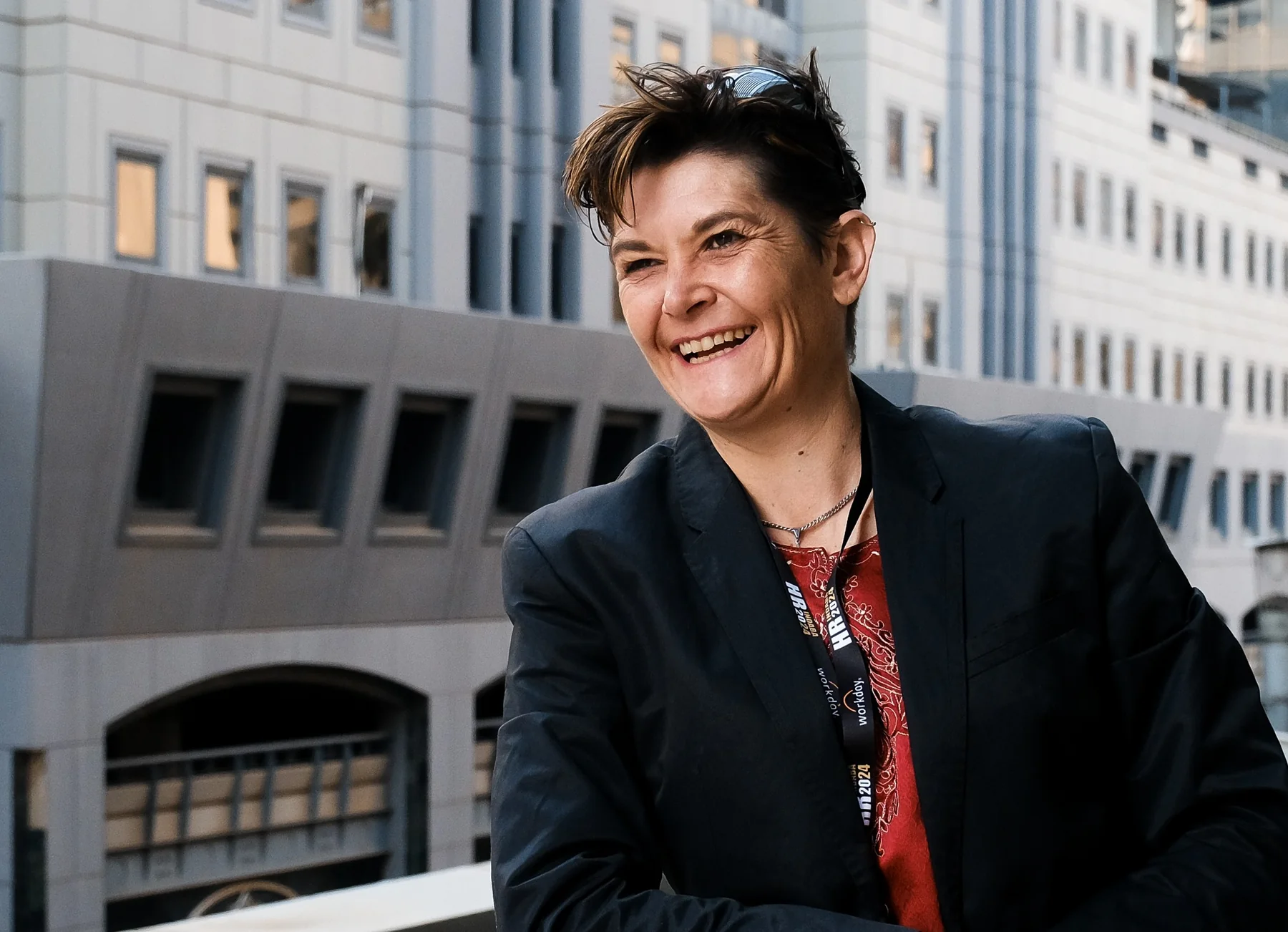 Nicola Mawson smiling outdoors in an urban setting
